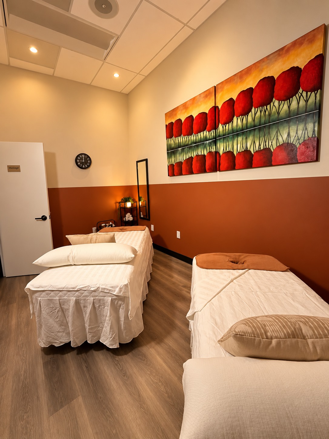 A Stillwater Spa couples massage room with two prepared treatment tables